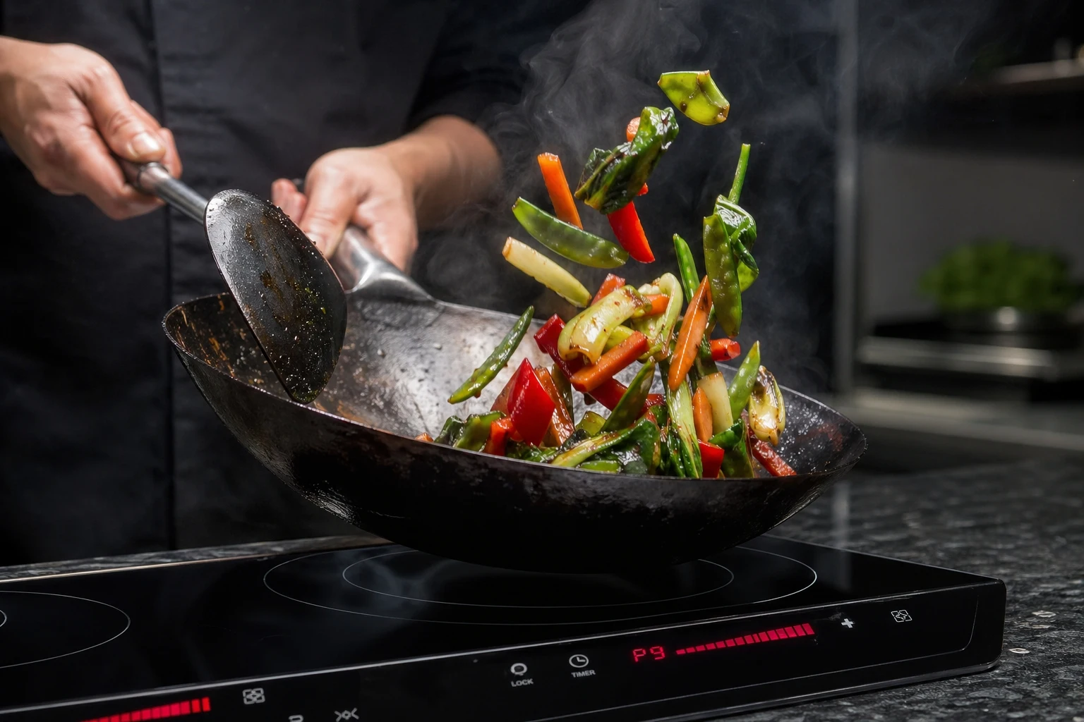 Best woks for induction cooktops 2026 - flat-bottom carbon steel woks from Mammafong Yosukata and Todlabe tested for induction compatibility heat response and wok hei performance
